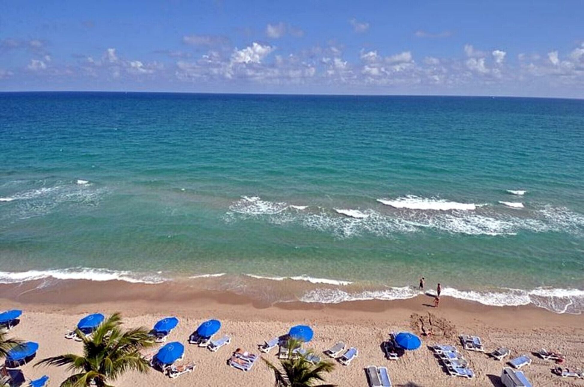 on the beach, sun-loungers, beach towels