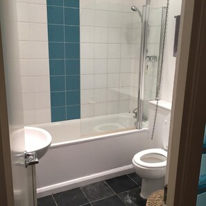 Bathtub, hair dryer, towels