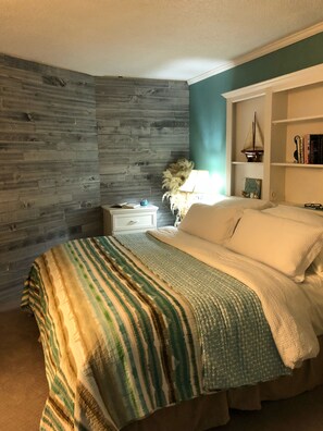 1 habitación, tabla de planchar con plancha y cuna de viaje 