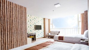 A hotel room with two beds, a desk with a chair, a TV, and a large window with curtains. - A Ace Hotel (Taichung)