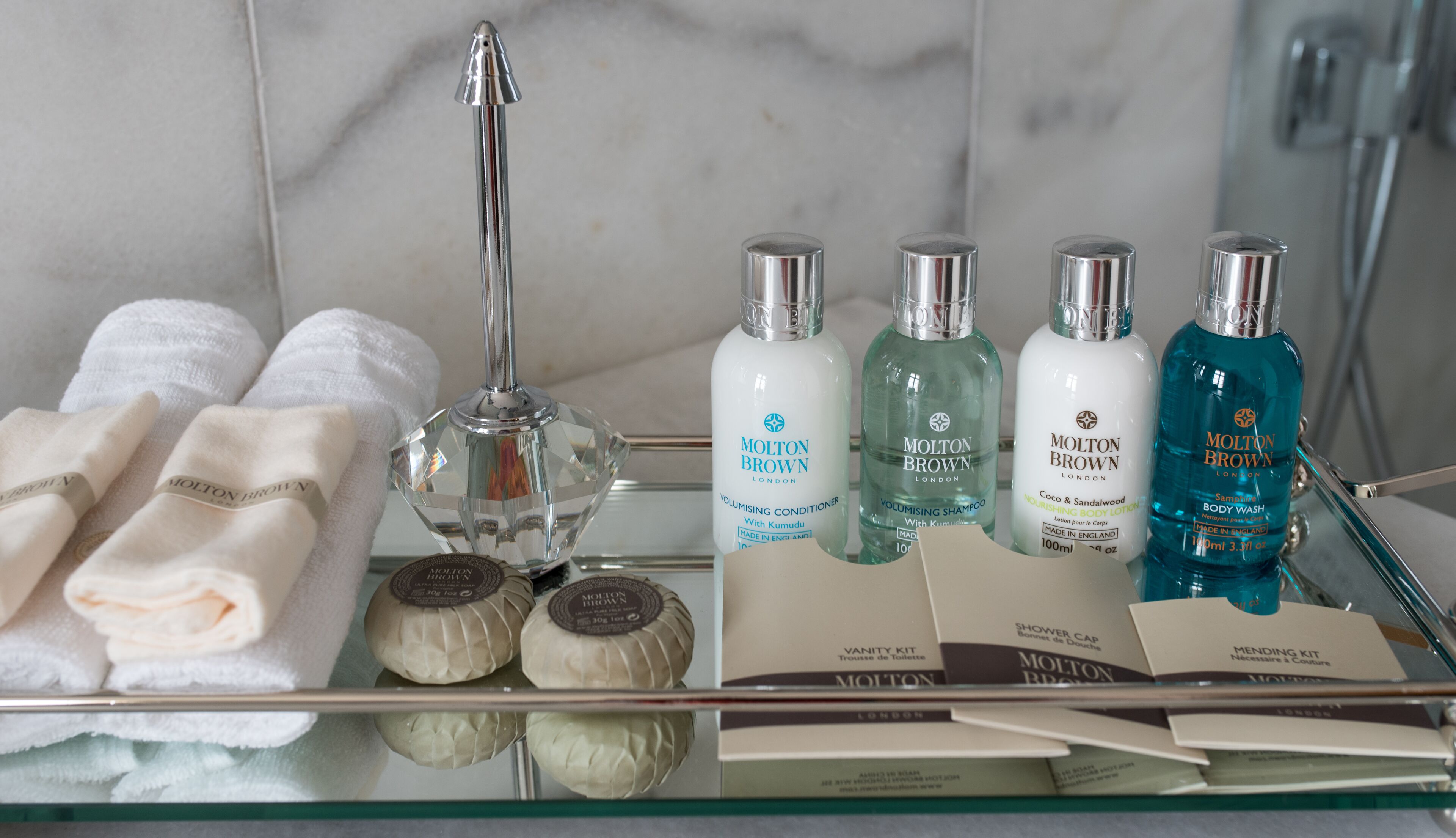 designer toiletries, hair dryer, bathrobes, slippers