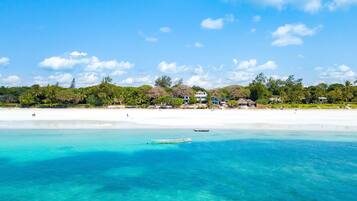 On the beach, sun loungers, beach towels