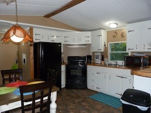 Kitchen with new refrigerator and ice maker
