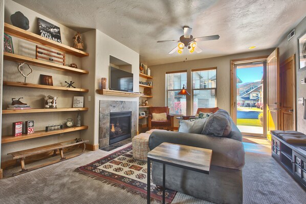 Smart TV, fireplace, books, printers