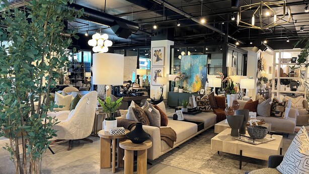 A modern furniture showroom with sofas, tables, and decorative plants. - Luxury condo, Walk to Theater & Restaurants, K & Q beds,  private gar. & grill (Park City)