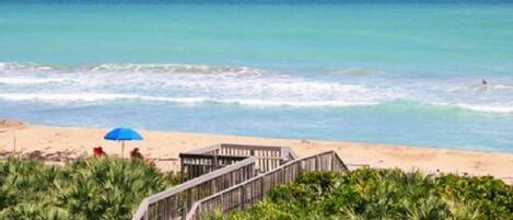 On the beach, sun-loungers, beach towels