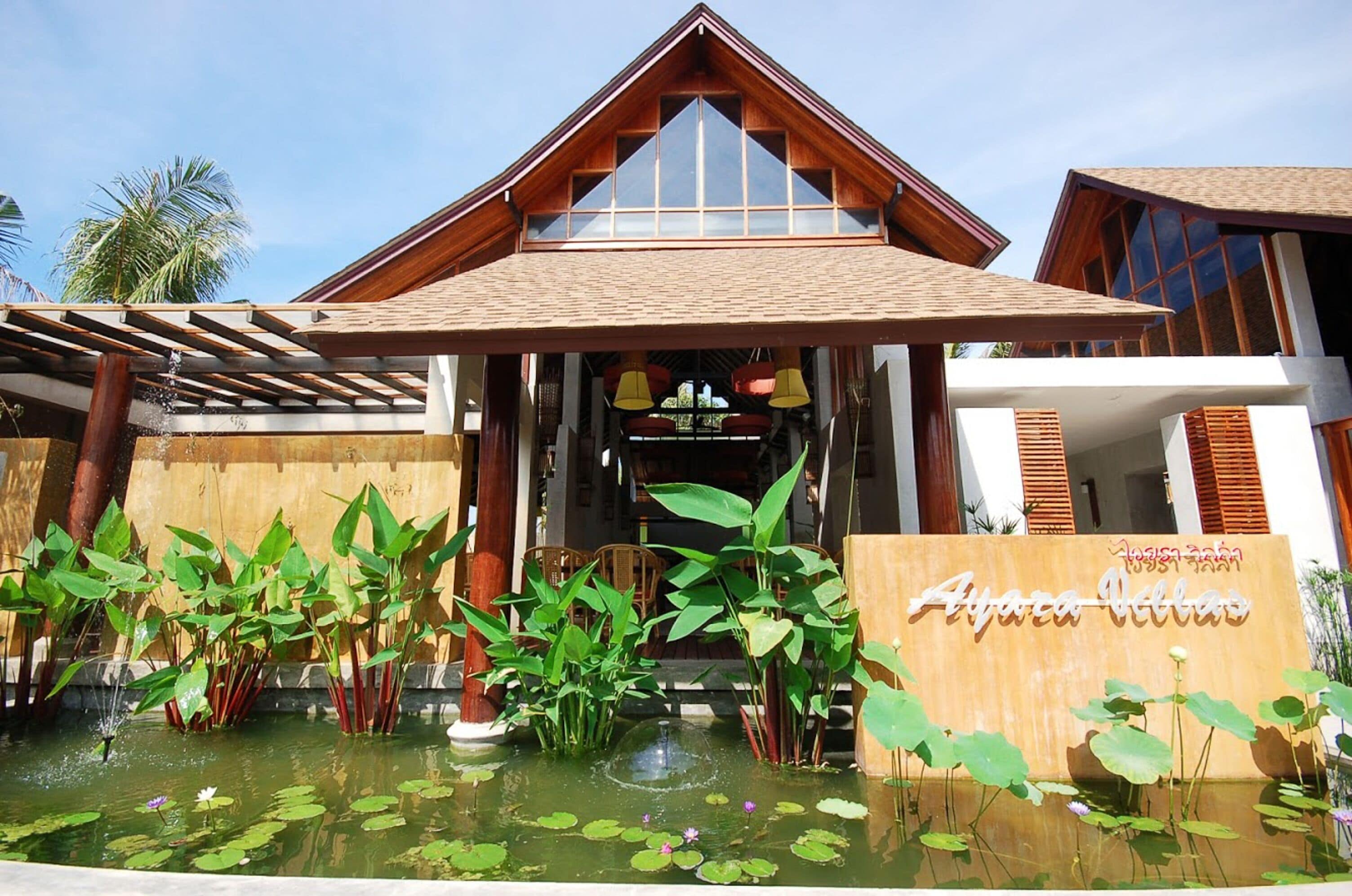 A hotel entrance with a sign reading "Ayara Villa."