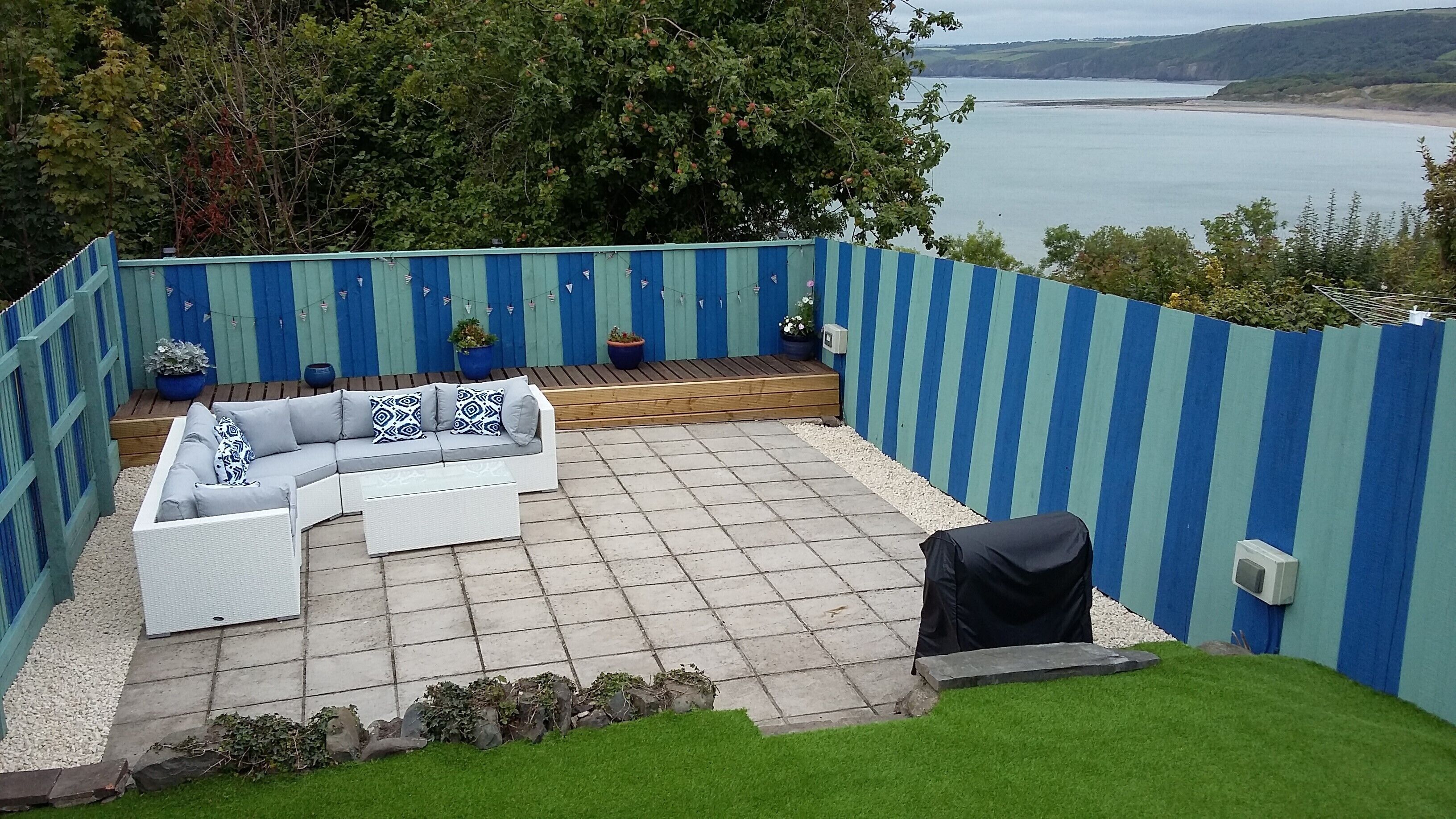 Enclosed rear garden with fantastic views, comfortable seating and barbecue.