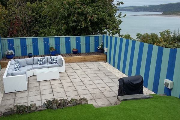 Enclosed rear garden with fantastic views, comfortable seating and barbecue.