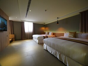 A hotel room with two beds, a large window with curtains, a flat-screen TV mounted on the wall, and a ceiling vent. - Wei Feng Motel (Kaohsiung)