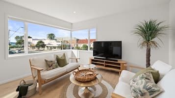Luxury Apartment | Living area | 60-inch Smart TV with digital channels, TV, Netflix