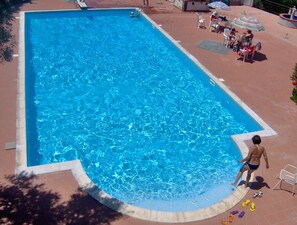 Seasonal outdoor pool, pool umbrellas, pool loungers