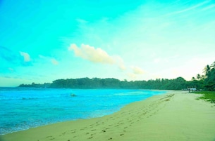 Beach nearby, white sand, sun loungers, beach umbrellas