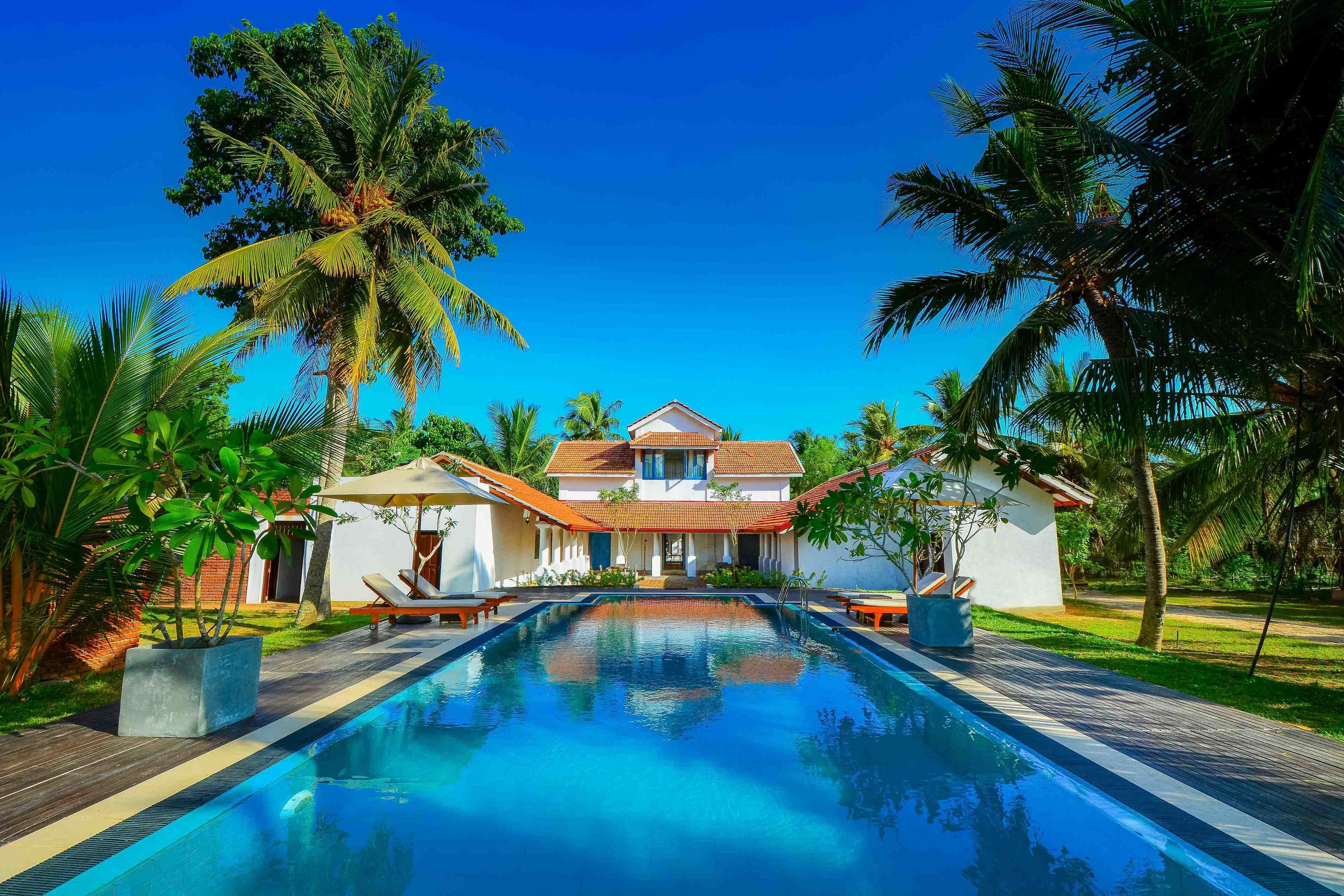 Outdoor pool, open 7 AM to 7 PM, pool umbrellas, sun loungers