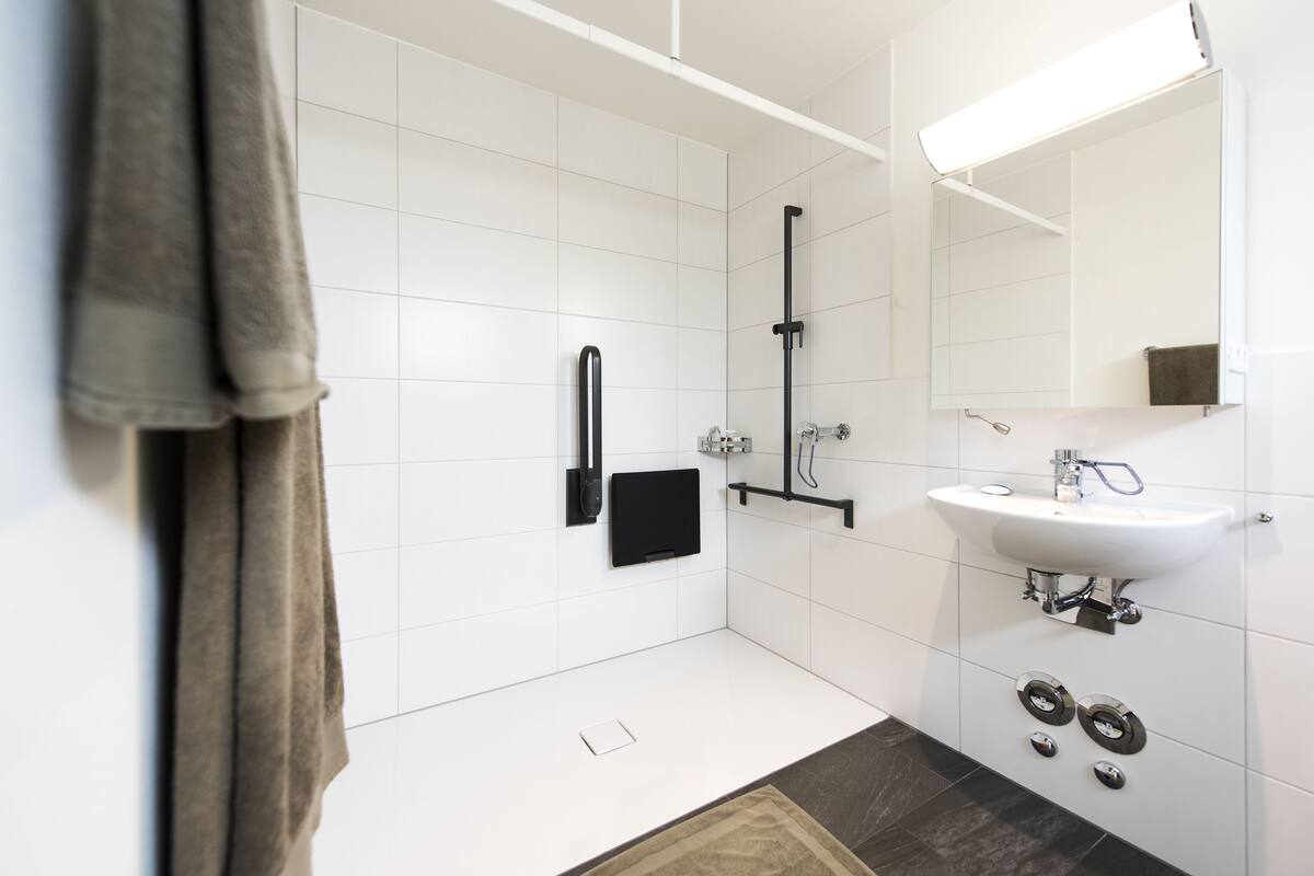 single room | bathroom | shower, hair dryer, towels, soap