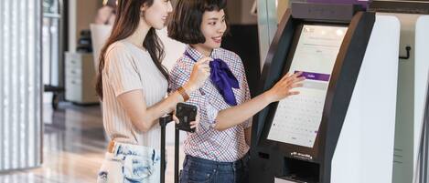 A self-service check-in kiosk at an airport.