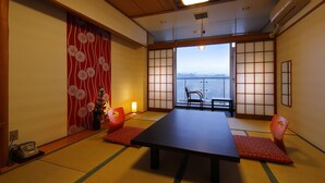 A traditional Japanese room with tatami flooring, a low table, and shoji screens. - Shokyoto No Yu Mikuma Hotel (Hita)