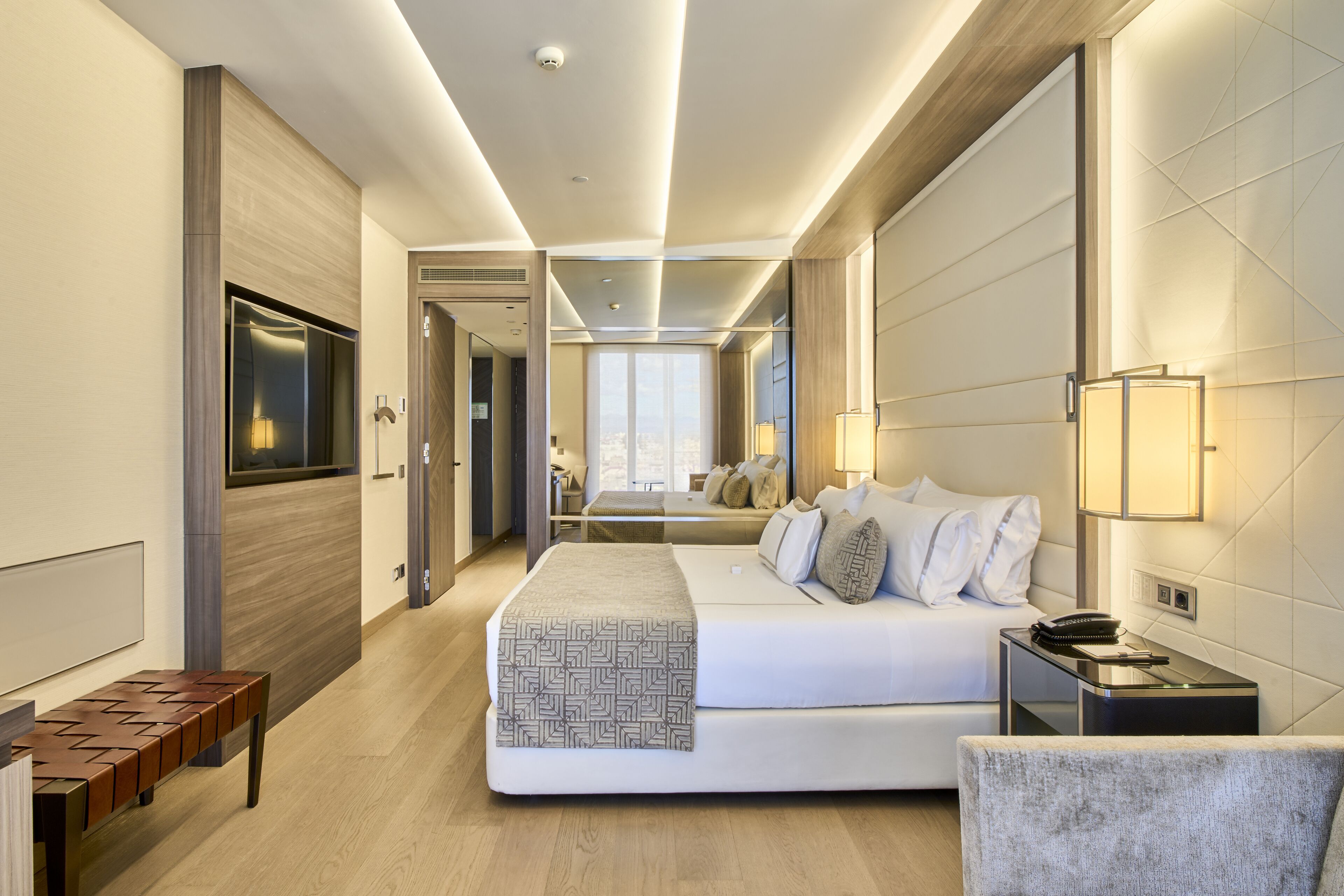 Luxe beddengoed, donsdekens, pillowtop-bedden, een minibar