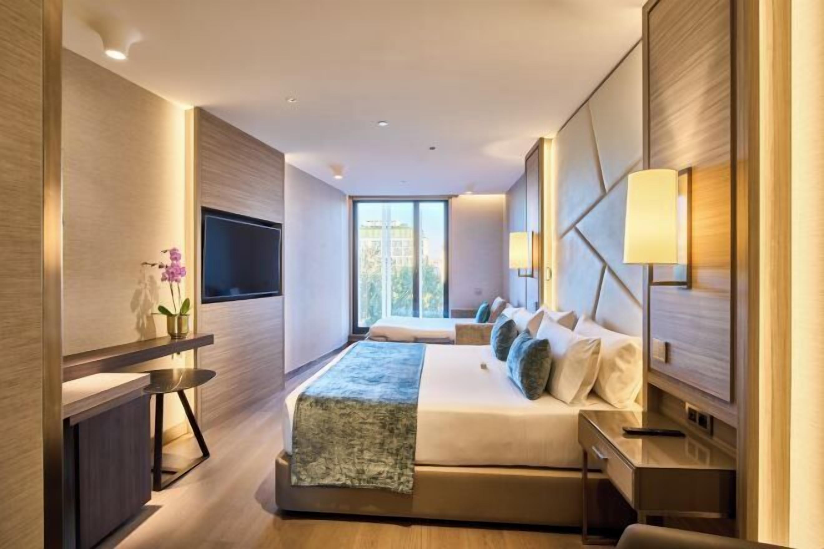 Luxe beddengoed, donsdekens, pillowtop-bedden, een minibar