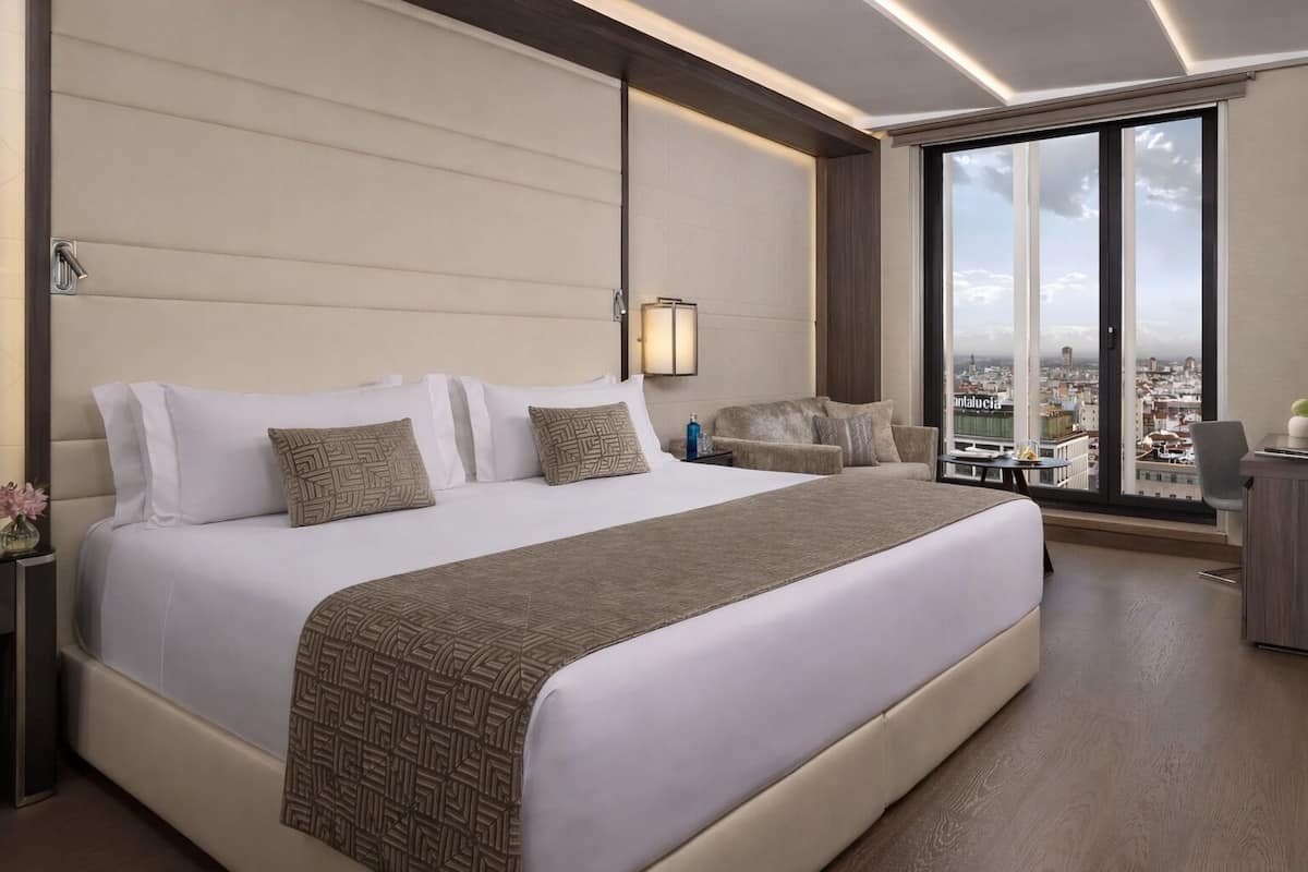 Premium bedding, down comforters, pillowtop beds, minibar