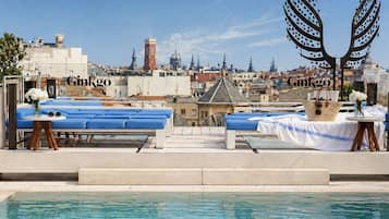 Seasonal outdoor pool, open 11:00 AM to 7:00 PM, pool loungers