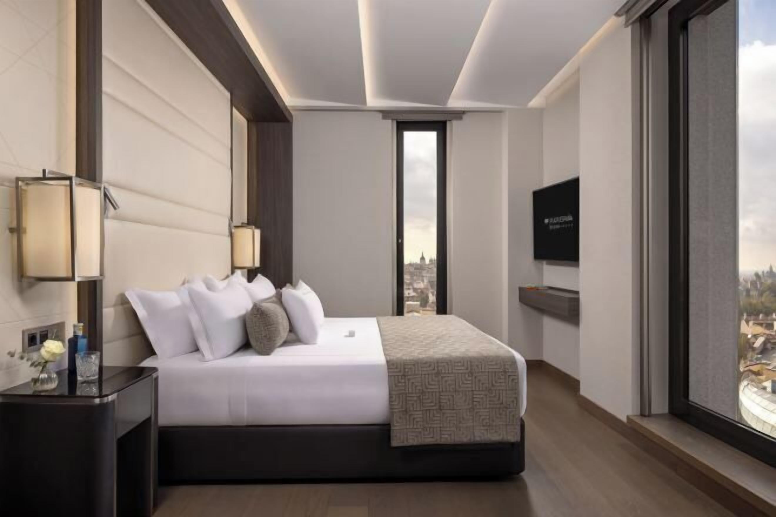 Luxe beddengoed, donzen dekbedden, pillowtop-bedden, een minibar