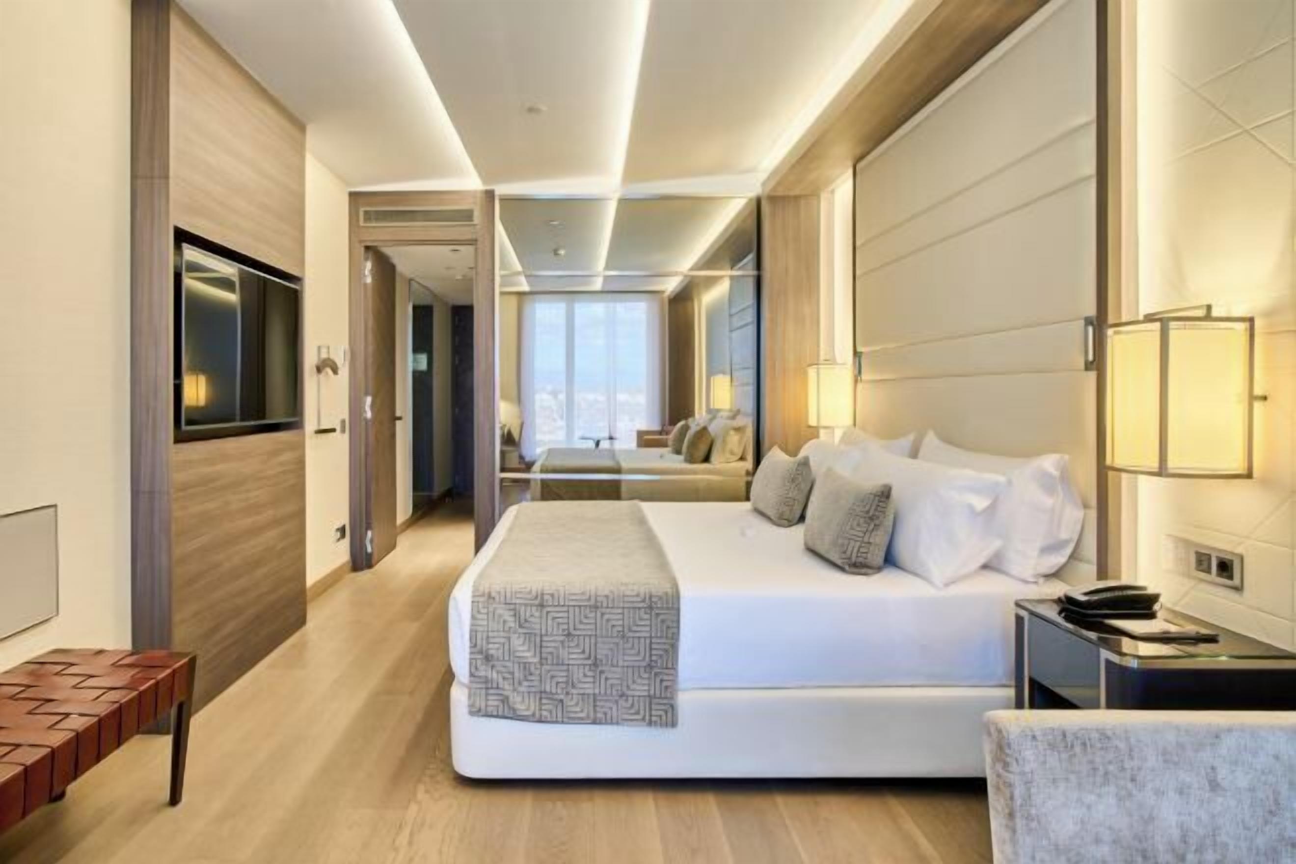 Luxe beddengoed, donsdekens, pillowtop-bedden, een minibar