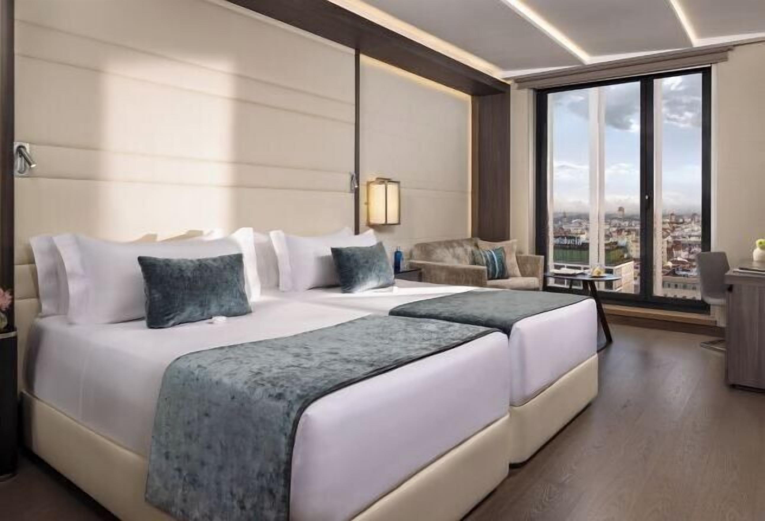 Luxe beddengoed, donzen dekbedden, pillowtop-bedden, een minibar