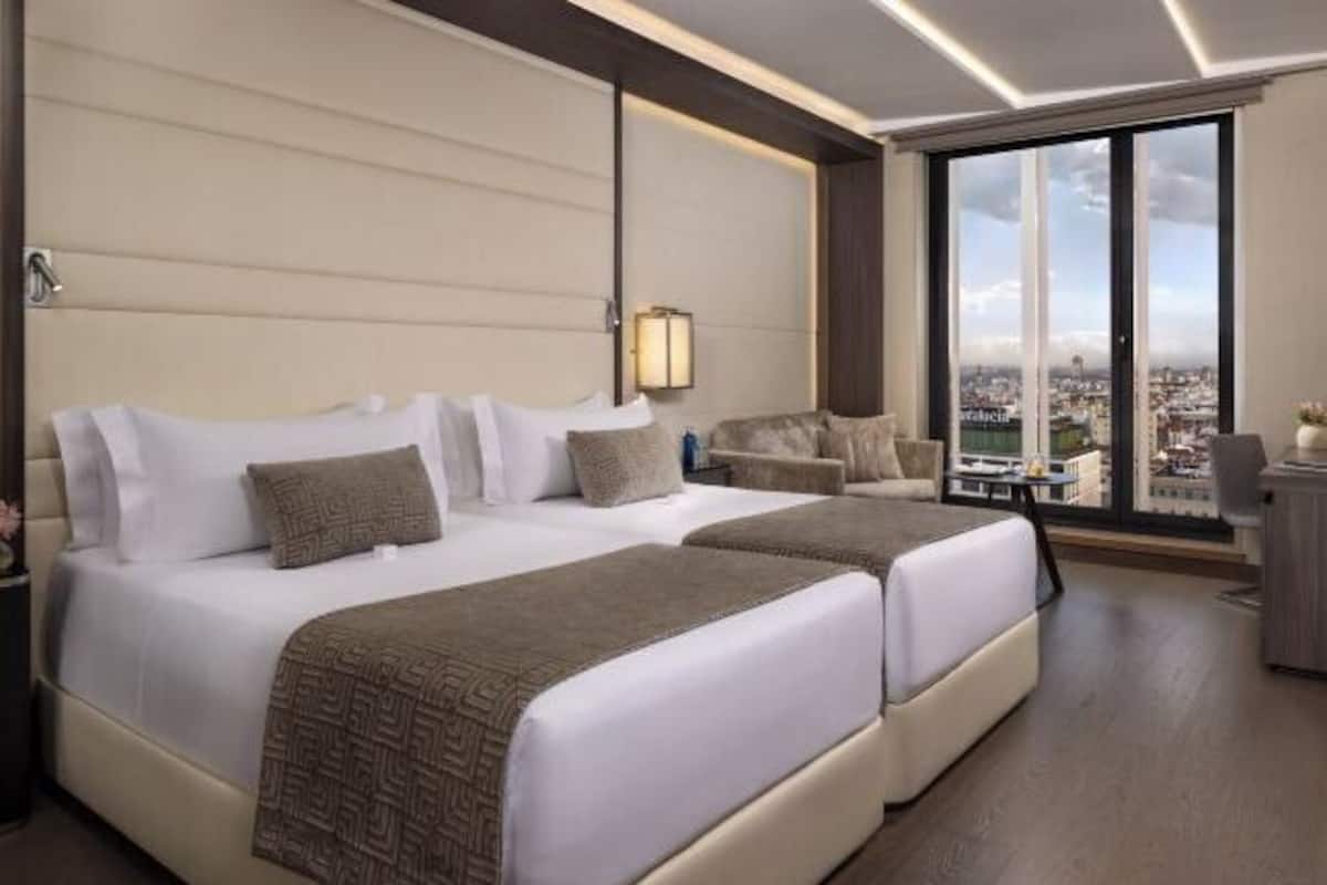 Luxe beddengoed, donzen dekbedden, pillowtop-bedden, een minibar