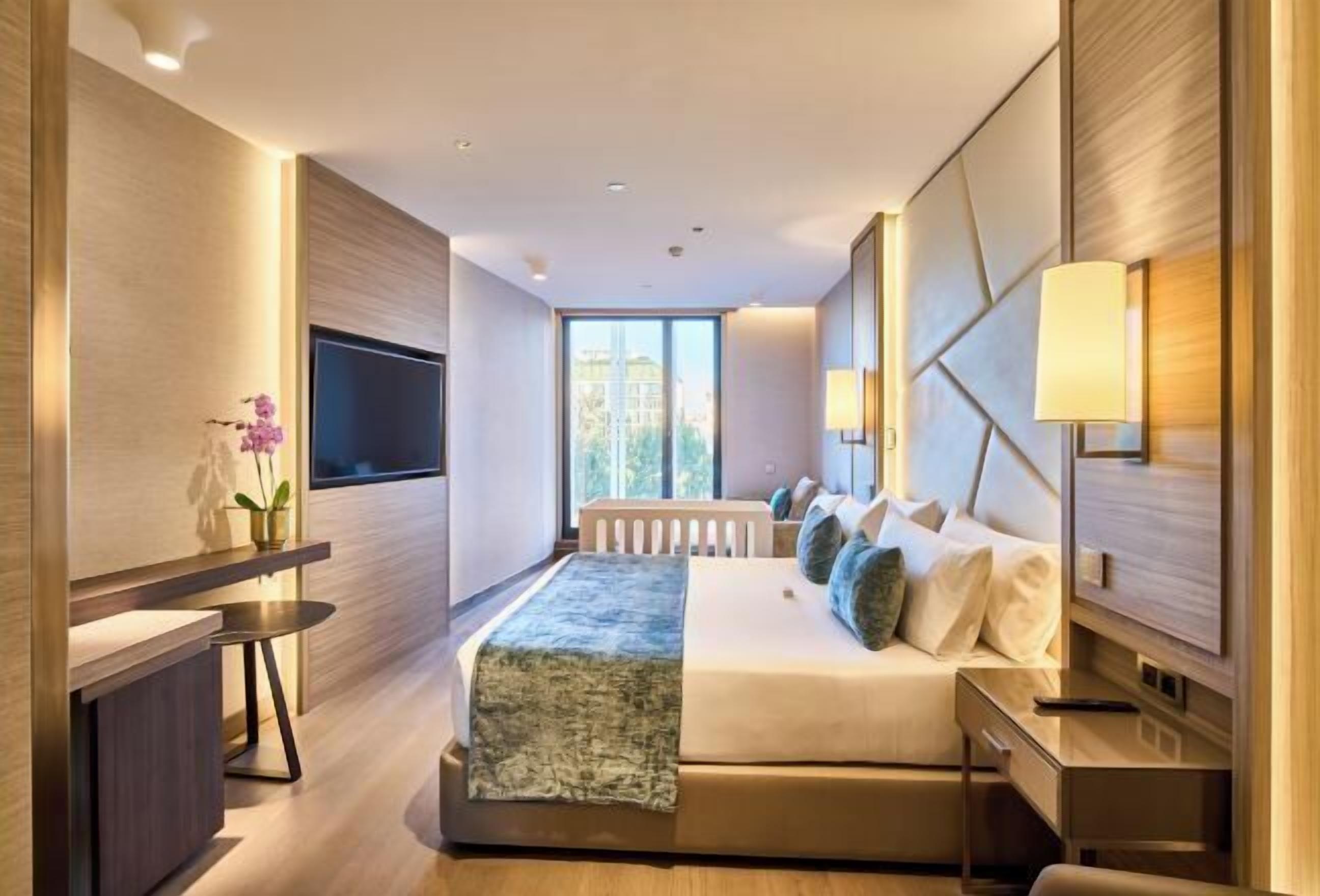 Luxe beddengoed, donsdekens, pillowtop-bedden, een minibar