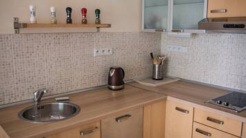 Premium Suite, City View | Private kitchen | Full-size fridge, microwave, oven, stovetop