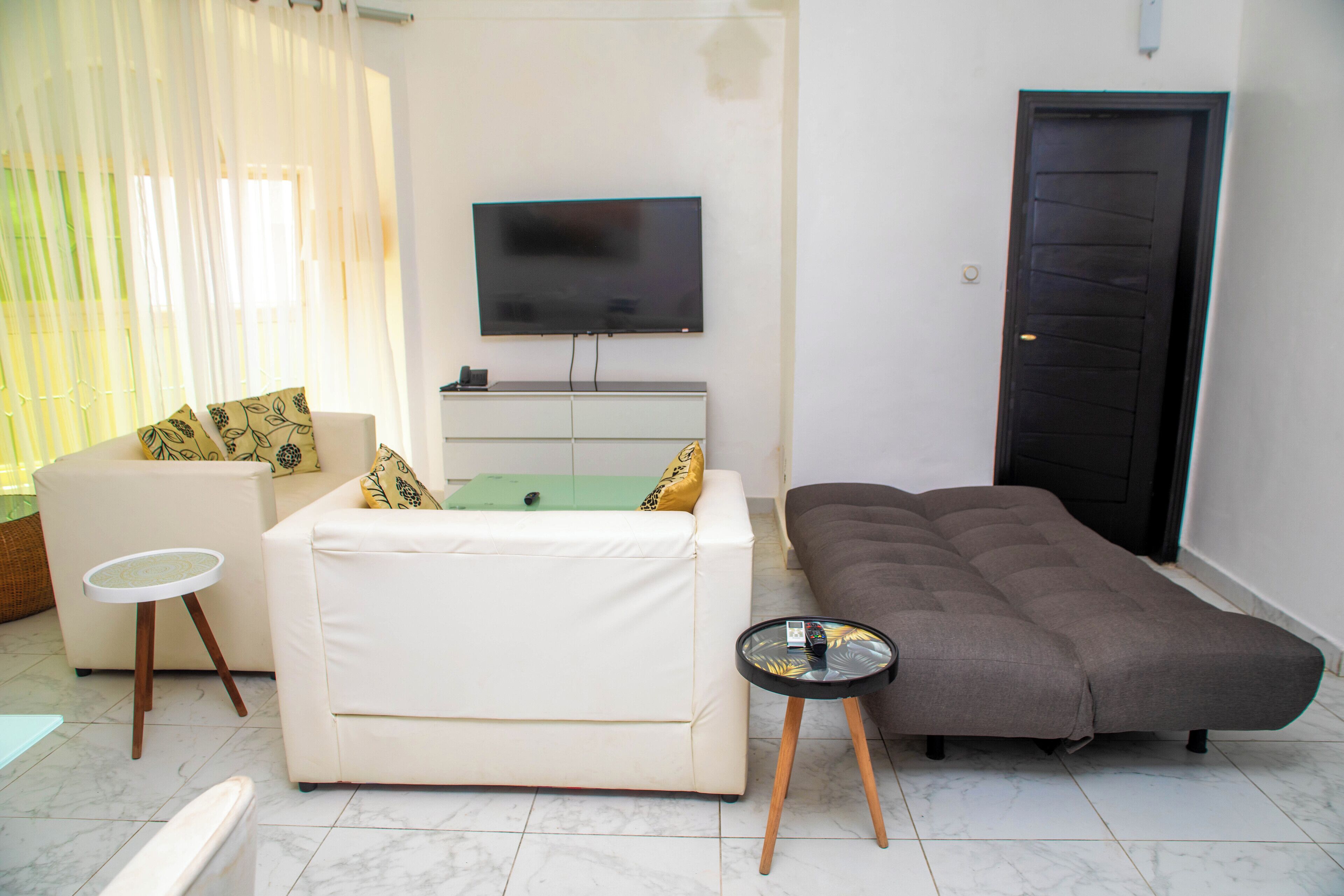 suite, kitchenette, pool view | living area | flat-screen tv