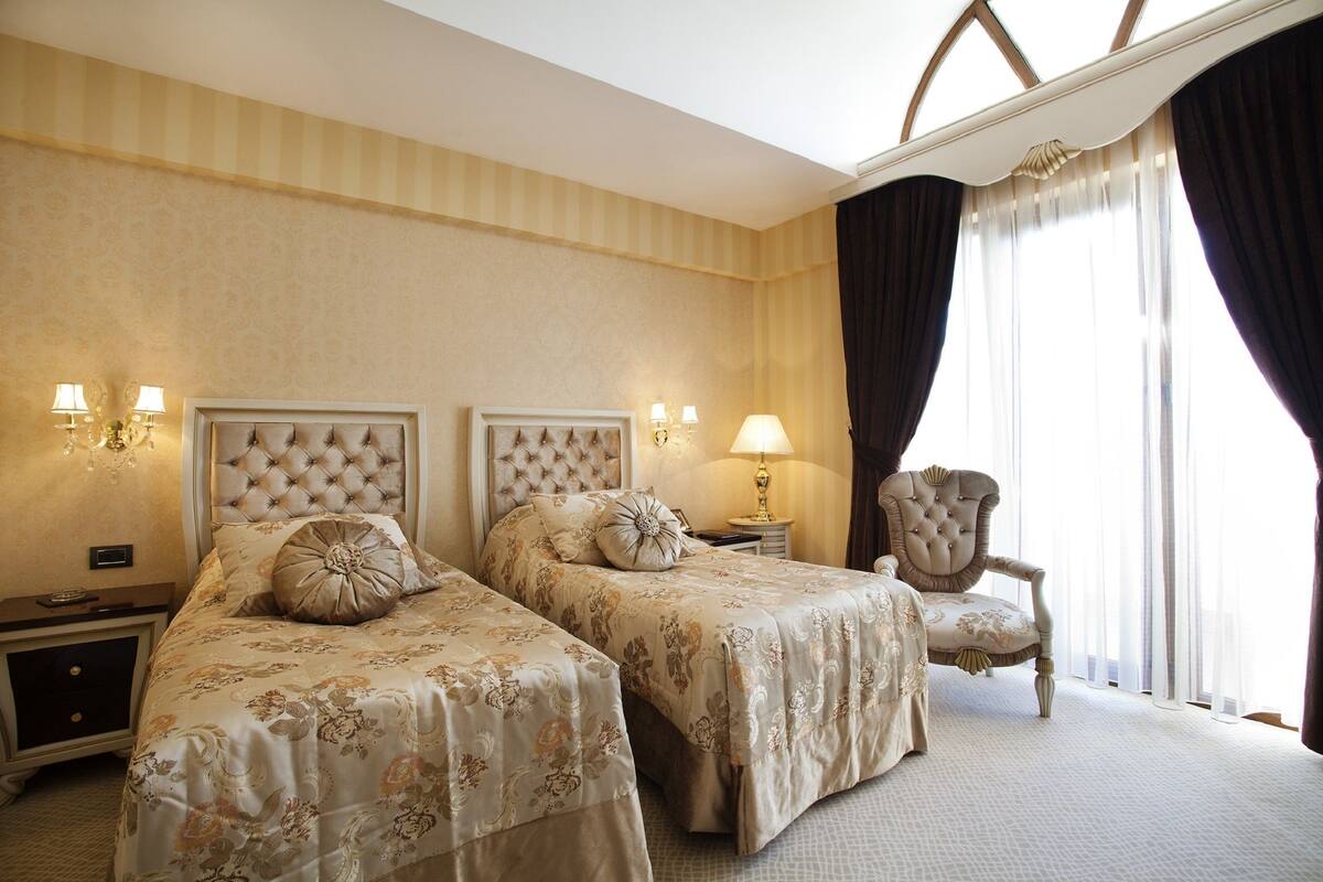 Superior Twin Room | Minibar, in-room safe, individually decorated, individually furnished
