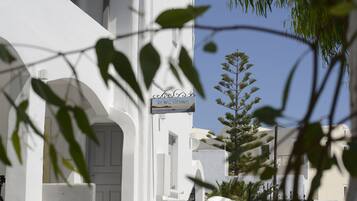 A white building with a sign reading "The Host Sunbeam."