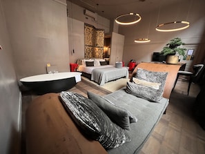 Signature Suite, 1 King Bed, Bathtub, Ground Floor | Premium bedding, pillowtop beds, minibar, in-room safe