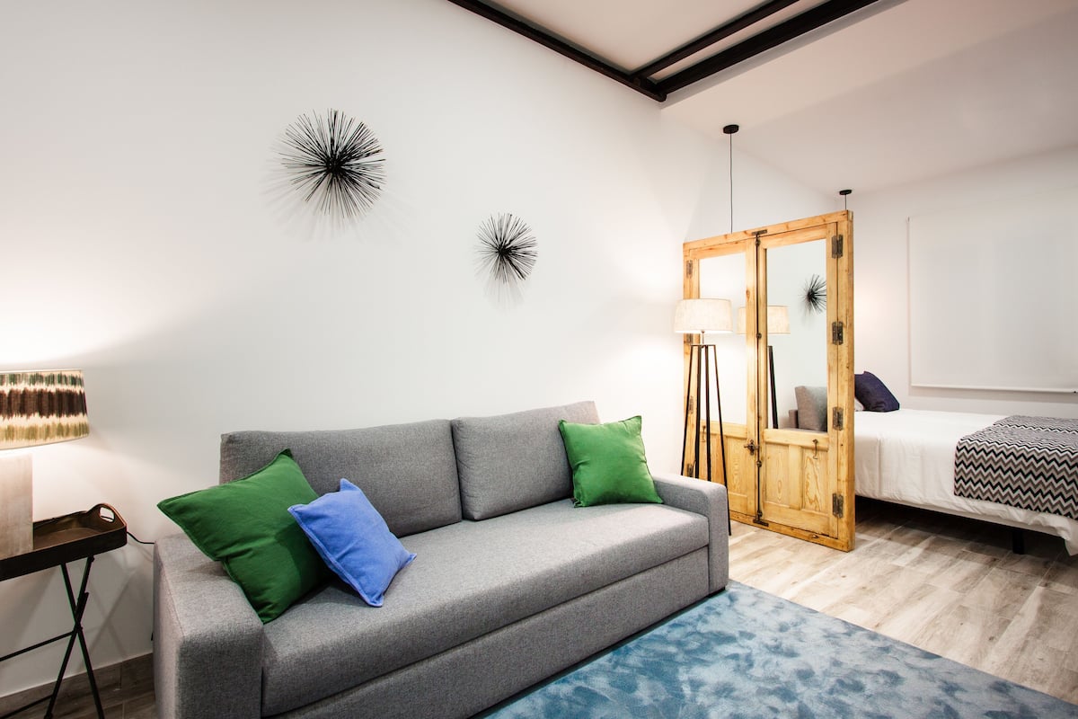 Premium bedding, desk, laptop workspace, blackout curtains