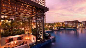 Outdoor pool, open 6:00 AM to 10:00 PM, free pool cabanas
