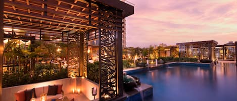 Outdoor pool, open 6:00 AM to 10:00 PM, free cabanas, pool umbrellas
