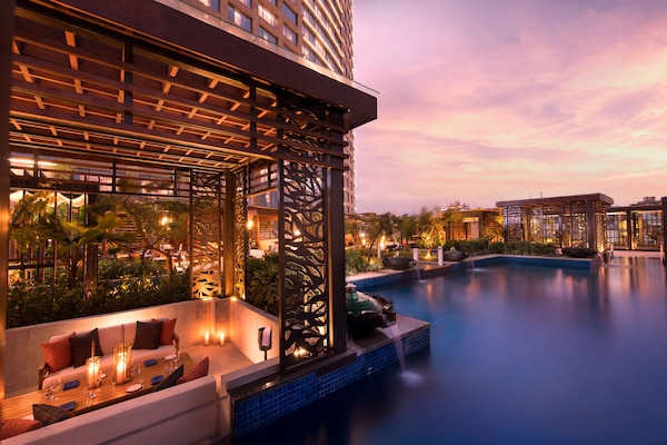 Outdoor pool, open 6:00 AM to 10:00 PM, free cabanas, pool umbrellas
