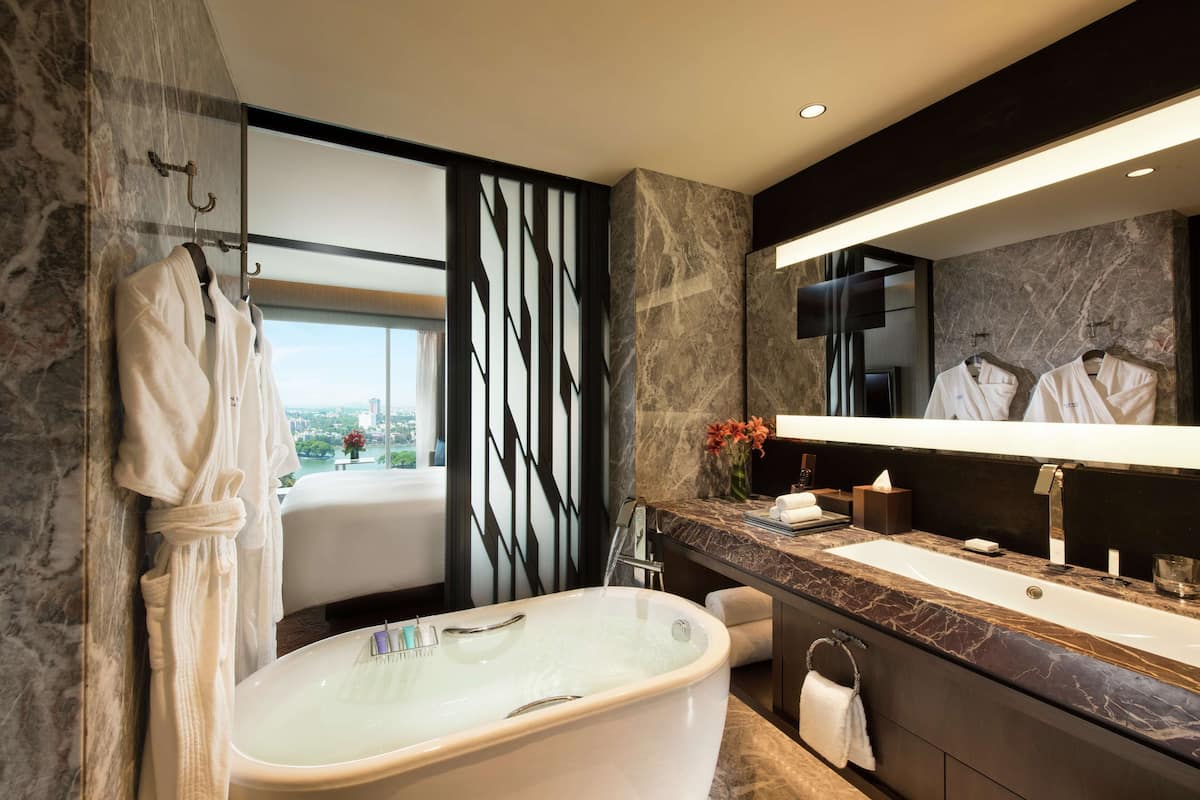 deep-soaking bathtub, rainfall showerhead, free toiletries, hair dryer