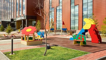 Children can play on the playground equipment at Garden Hall.