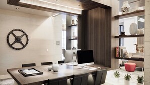 A modern conference room with a wooden table, black chairs, and a large monitor. - AC Hotel by Marriott Tucson Downtown (Tucson)