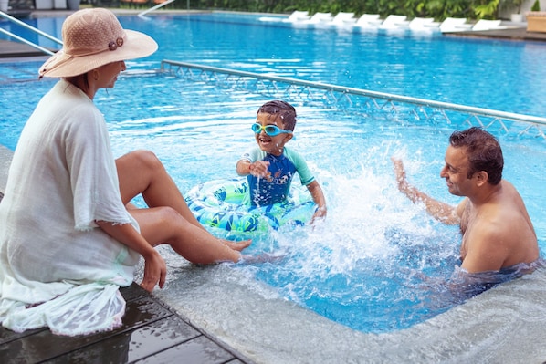 Outdoor pool, open 8:00 AM to 8:00 PM, pool umbrellas