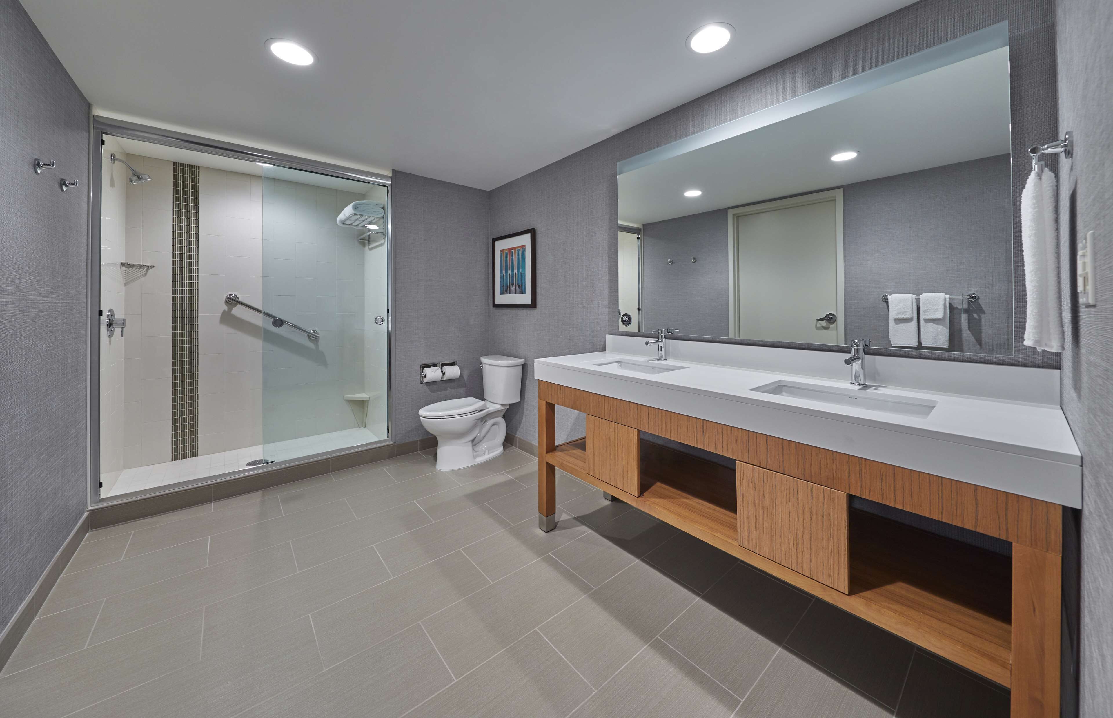 shower, designer toiletries, hair dryer, towels