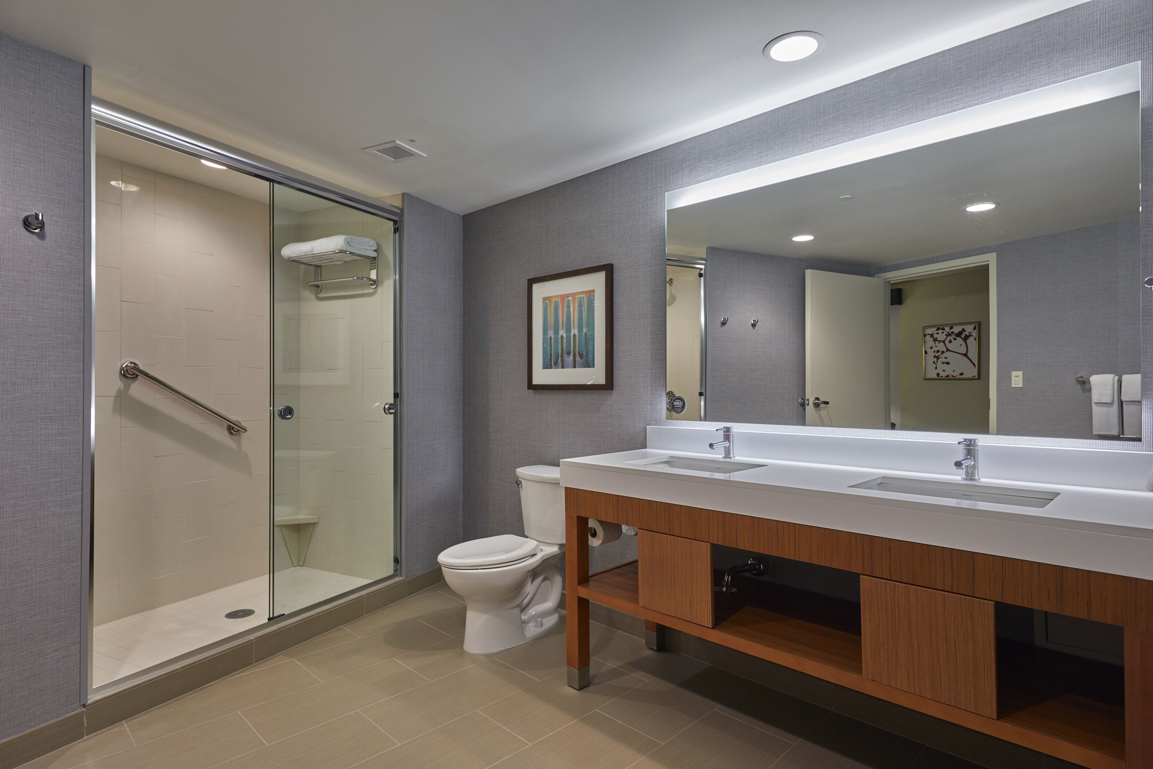 shower, designer toiletries, hair dryer, towels