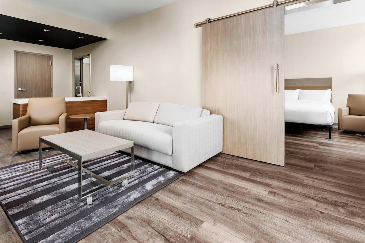 Suite, 2 Queen Beds, Corner | In-room safe, desk, blackout curtains, iron/ironing board