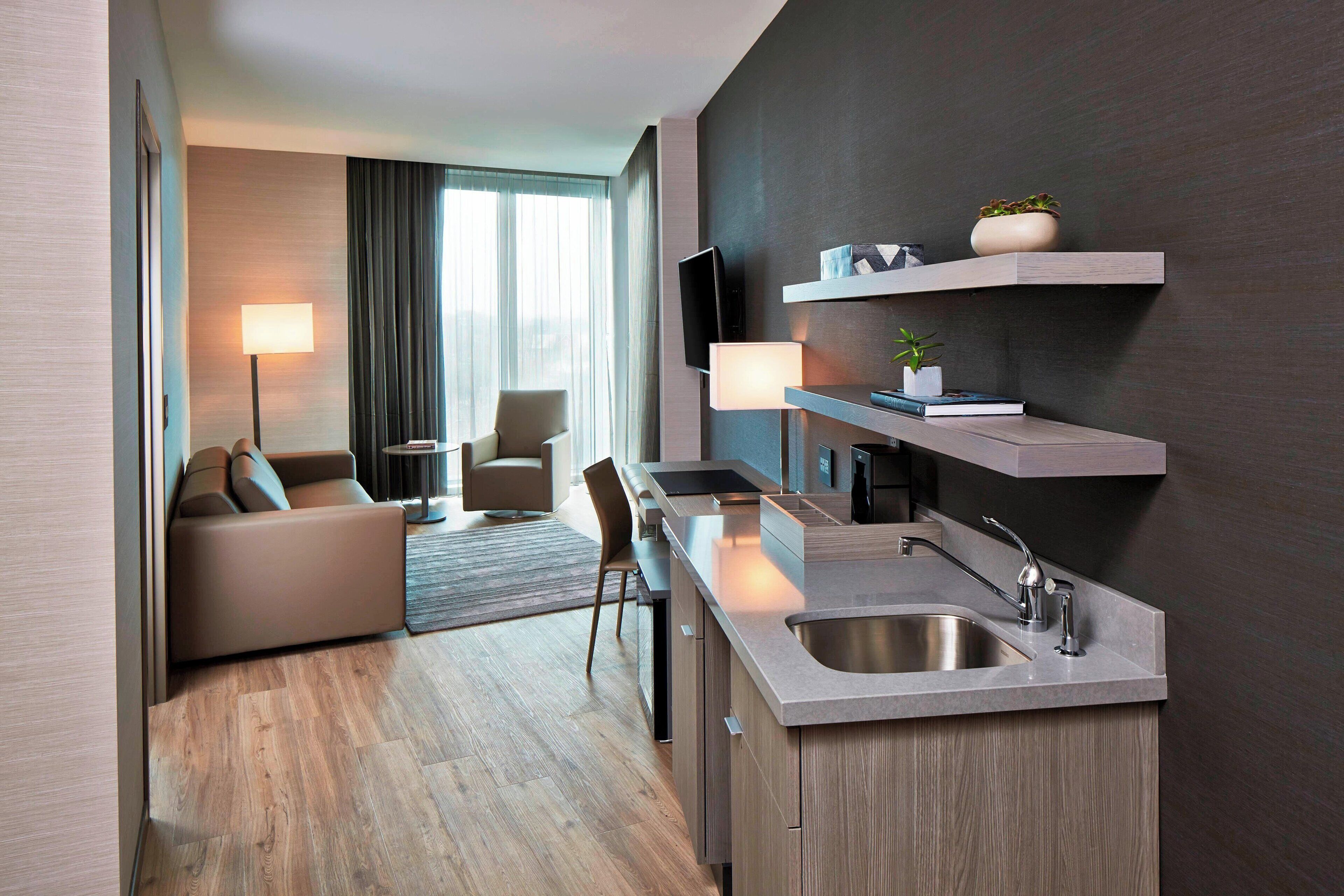 premium bedding, pillow-top beds, desk, laptop workspace