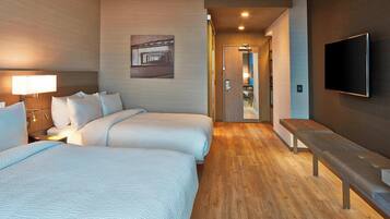 Premium bedding, pillow-top beds, desk, laptop workspace