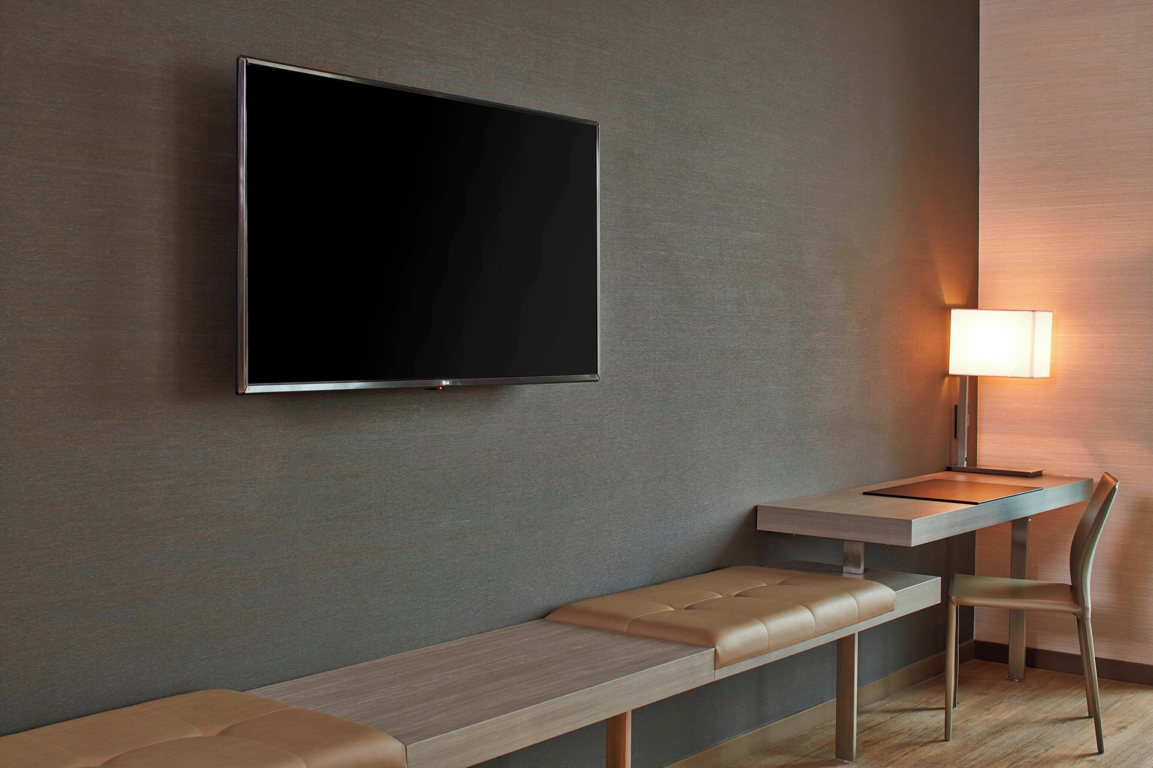 premium bedding, pillow-top beds, desk, laptop workspace