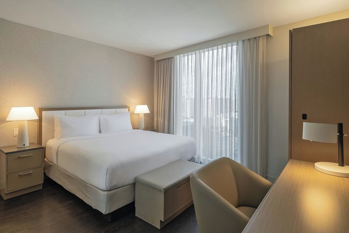 Hypo-allergenic bedding available, down comforters, in-room safe, desk